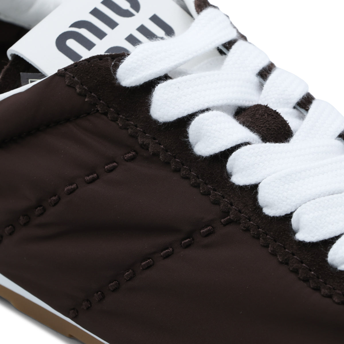 BROWN AND WHITE PLUME SNEAKERS