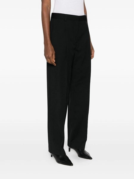 Pantaloni con pieghe