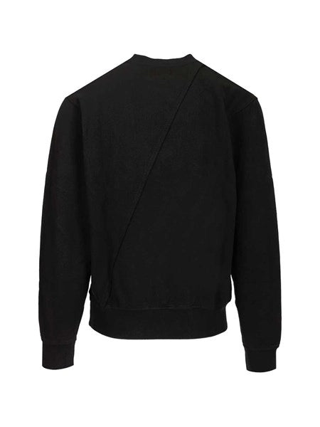 Maglione con ricamo del logo circolare