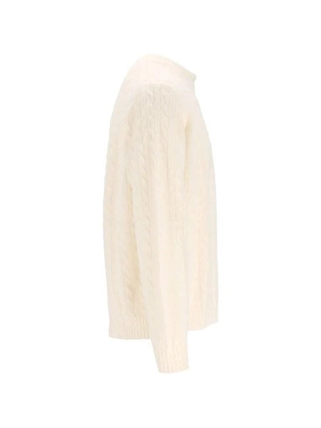 Pullover a trecce