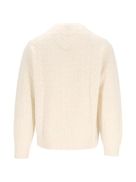Pullover a trecce