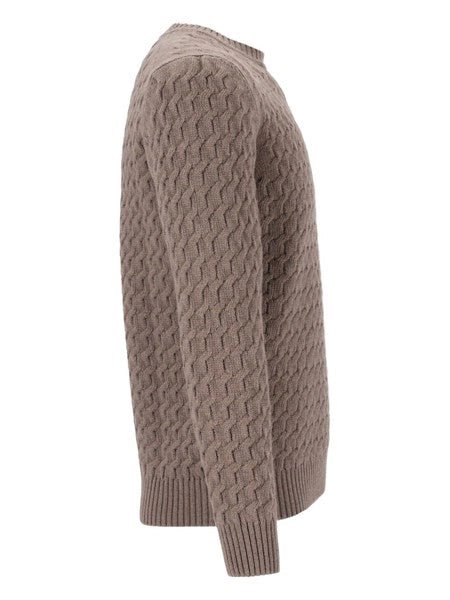 Maglione a trecce