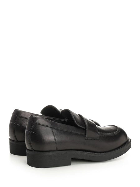 Mocassin con cuciture a vista