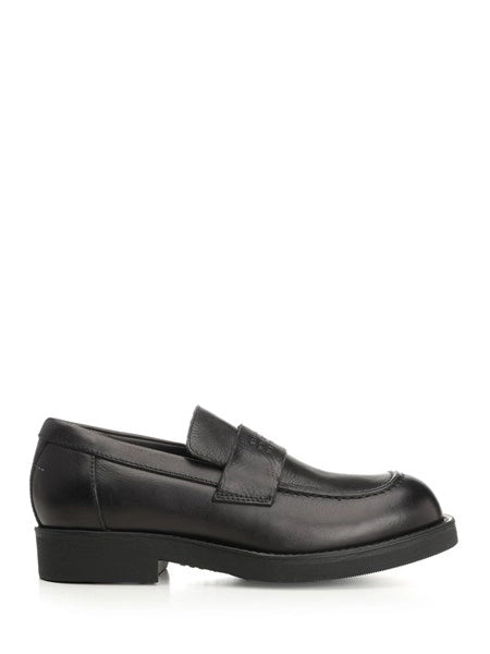 Mocassin con cuciture a vista