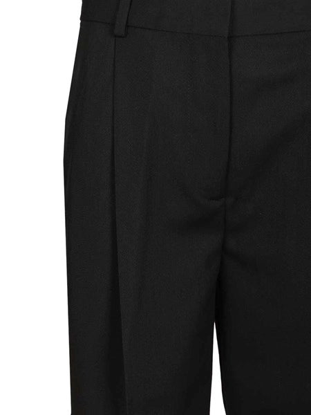 Pantaloni con pieghe