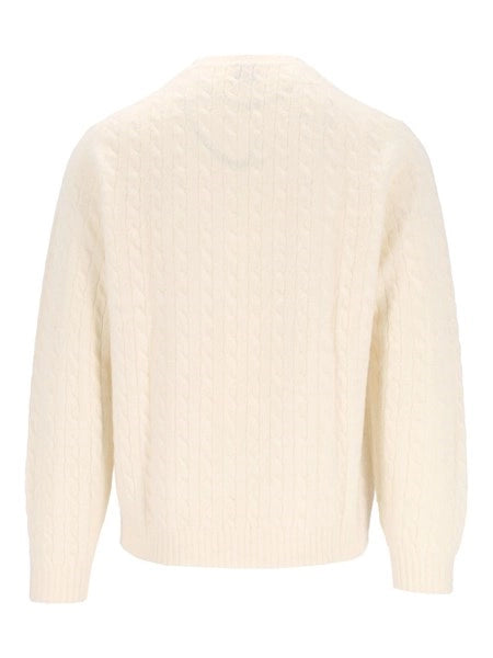 Pullover a trecce