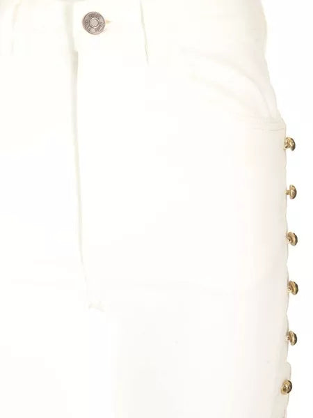 Jeans crop con borchie