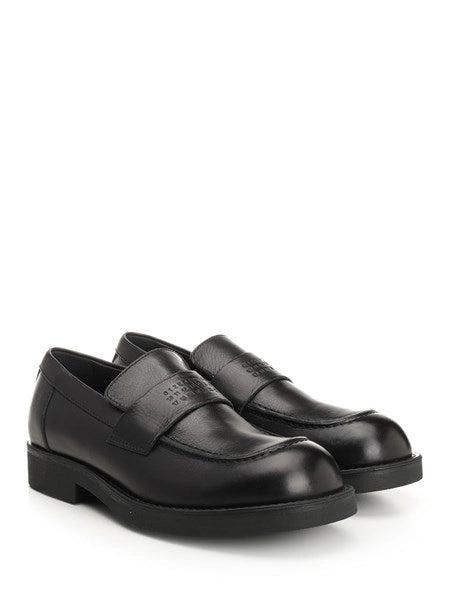 Mocassin con cuciture a vista