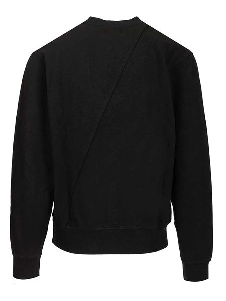 Maglione con ricamo del logo circolare