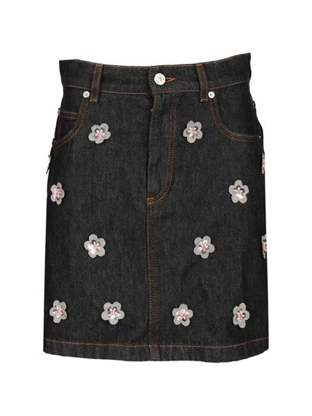Gonna in denim nero con applicazioni a forma di margherita