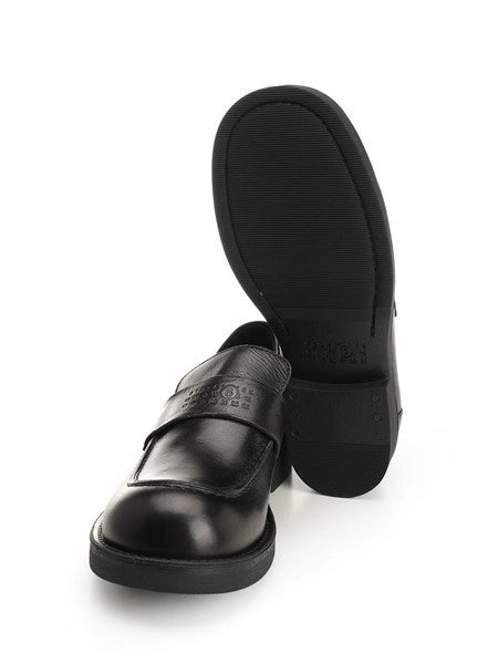 Mocassin con cuciture a vista