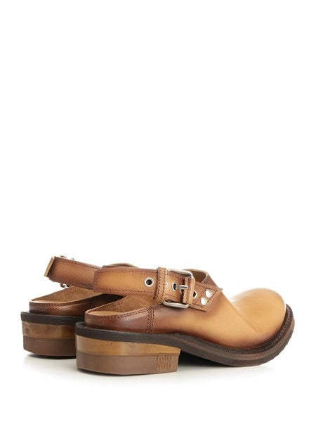 Mules in pelle
